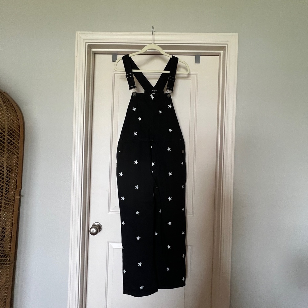 Black overalls with embroidered stars